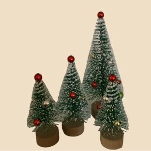 4 Decorated Bottle Brush trees. In good condition.